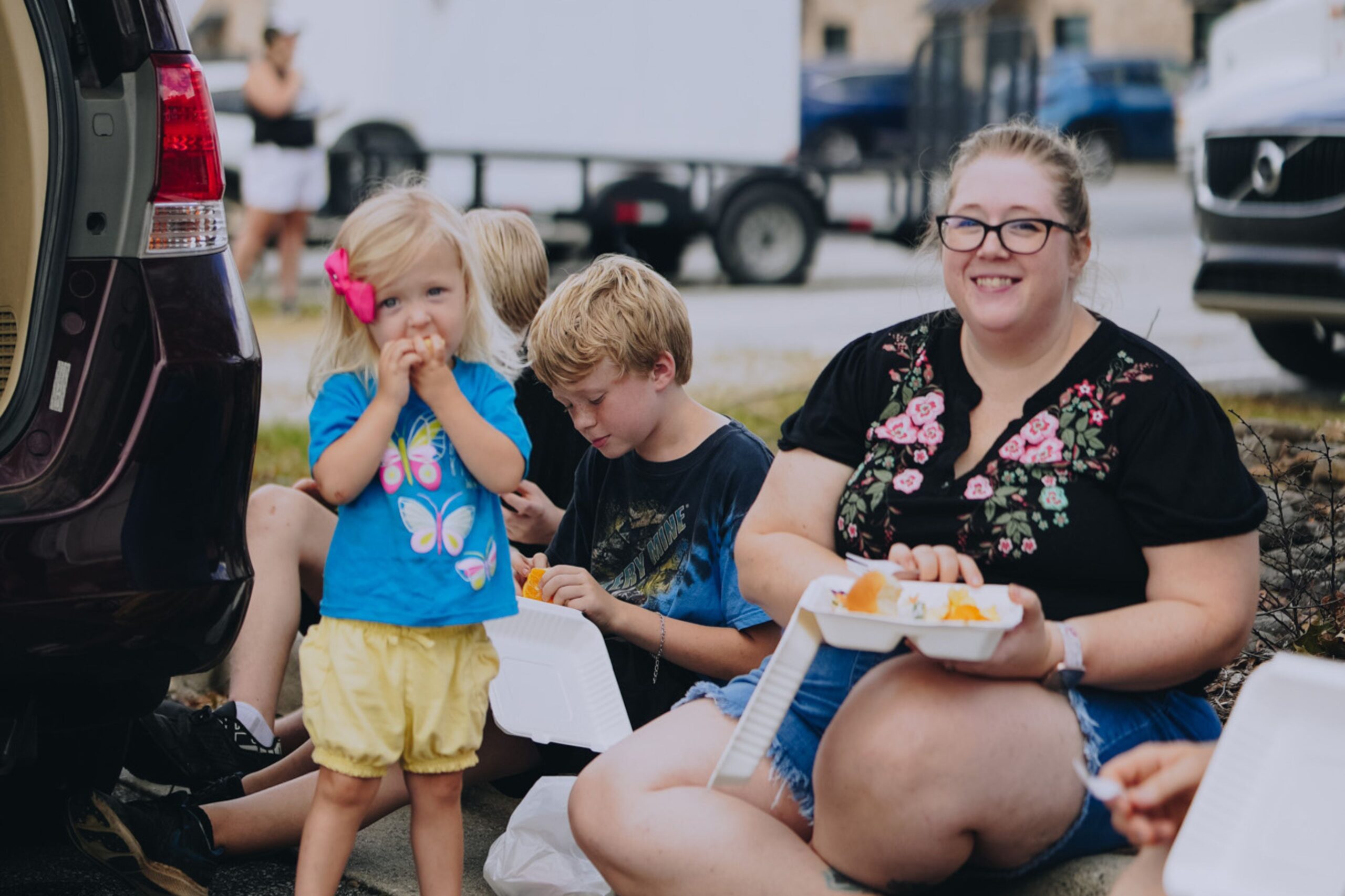 Family eating a Mercy Chefs meal in western North Carolina in the aftermath of Hurricane Helene