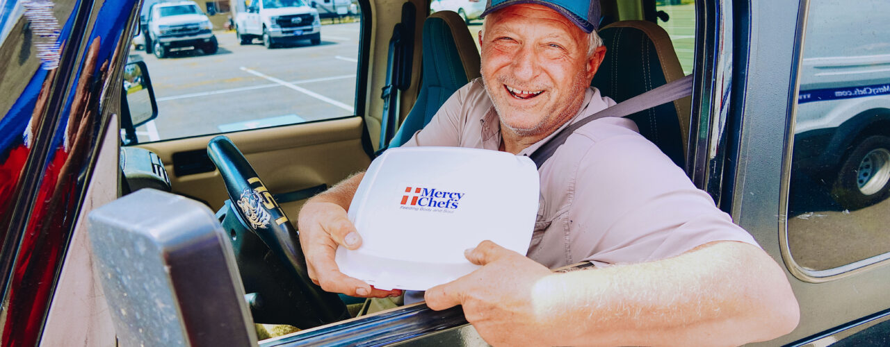 Man receiving a Mercy Chefs meal