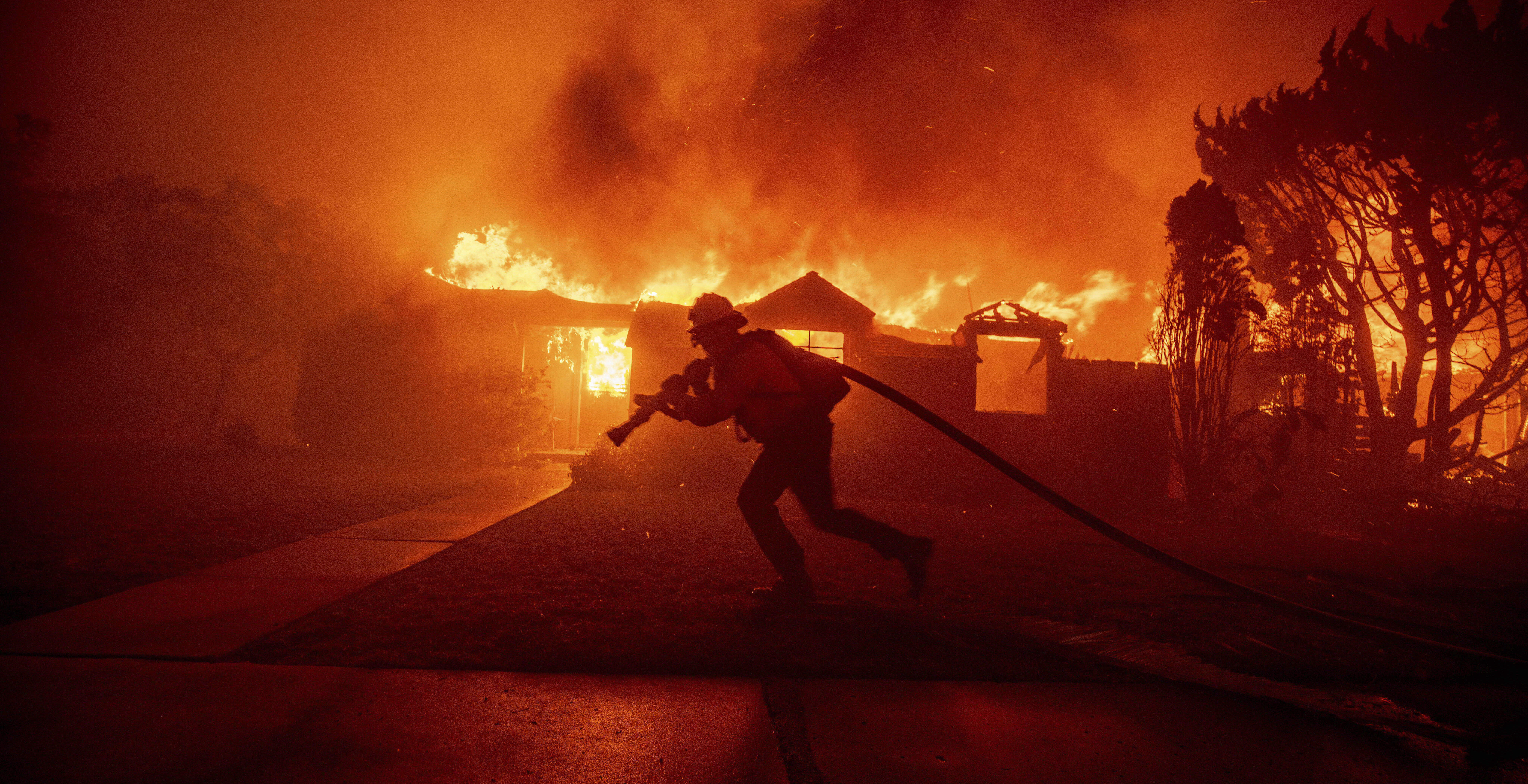 Firefighter battling intense wildfires in Southern California.