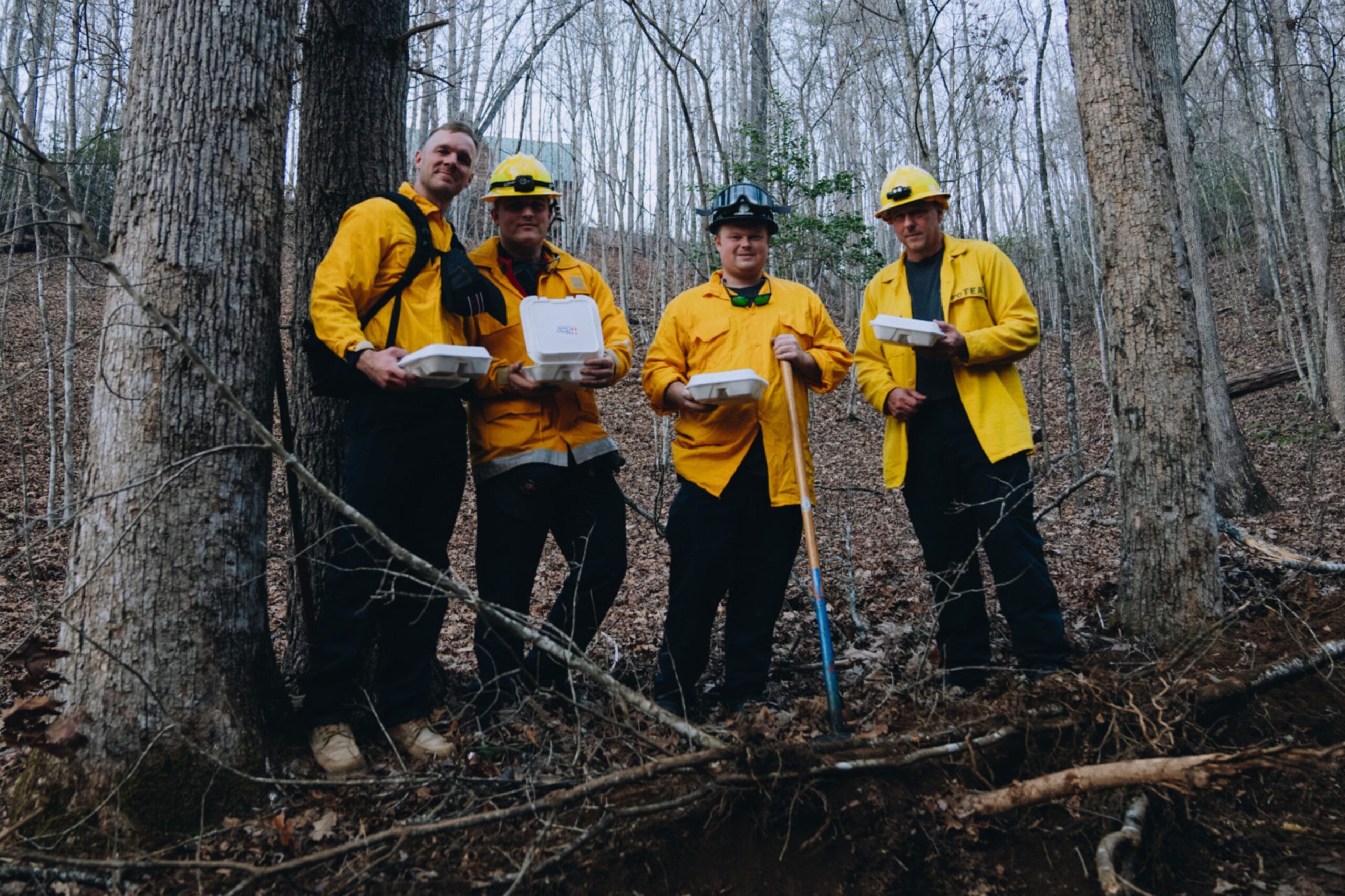 Firefighters enjoy a Mercy Chefs meal while battling wildfires in Western North Carolina.