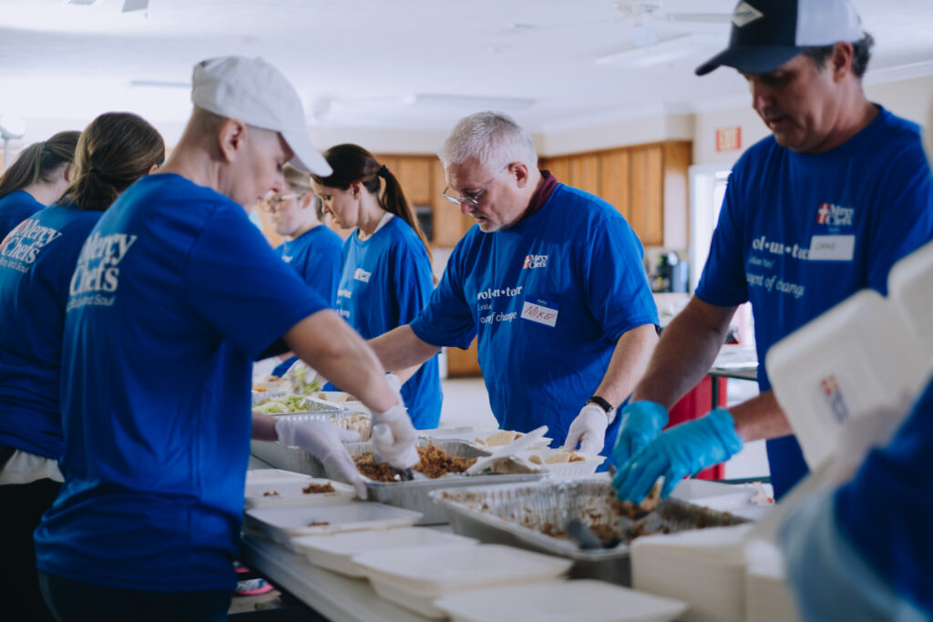 Volunteers serving meals for tornado survivors in Mississippi.