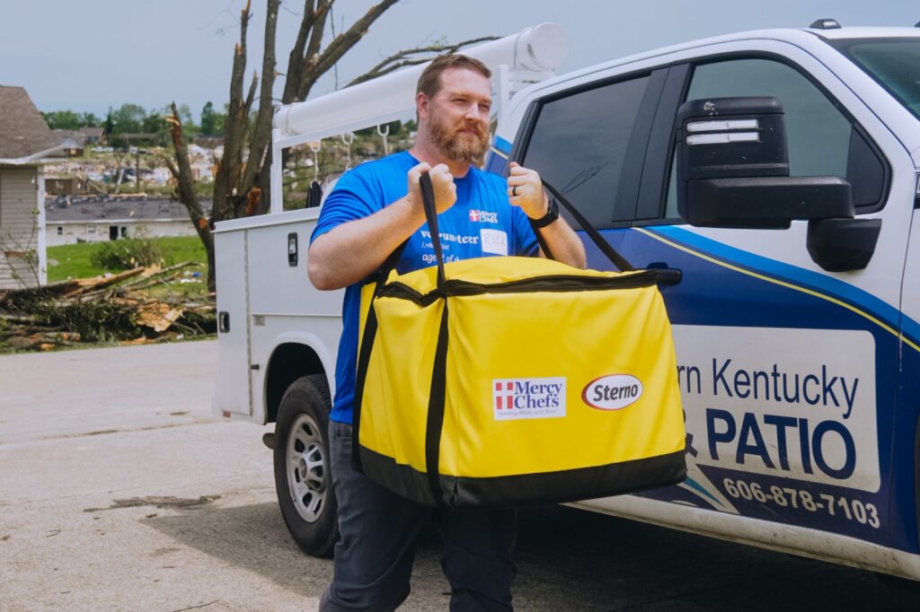 Volunteer helping distribute meals to tornado victims in London, KY