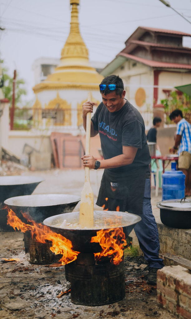 Chef Chris cooking in an open fire in Myanmar