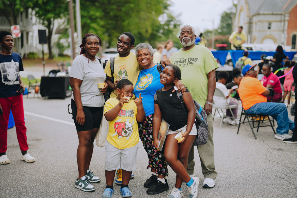 A family at the 2025 Back-to-School Block Party in Portsmouth