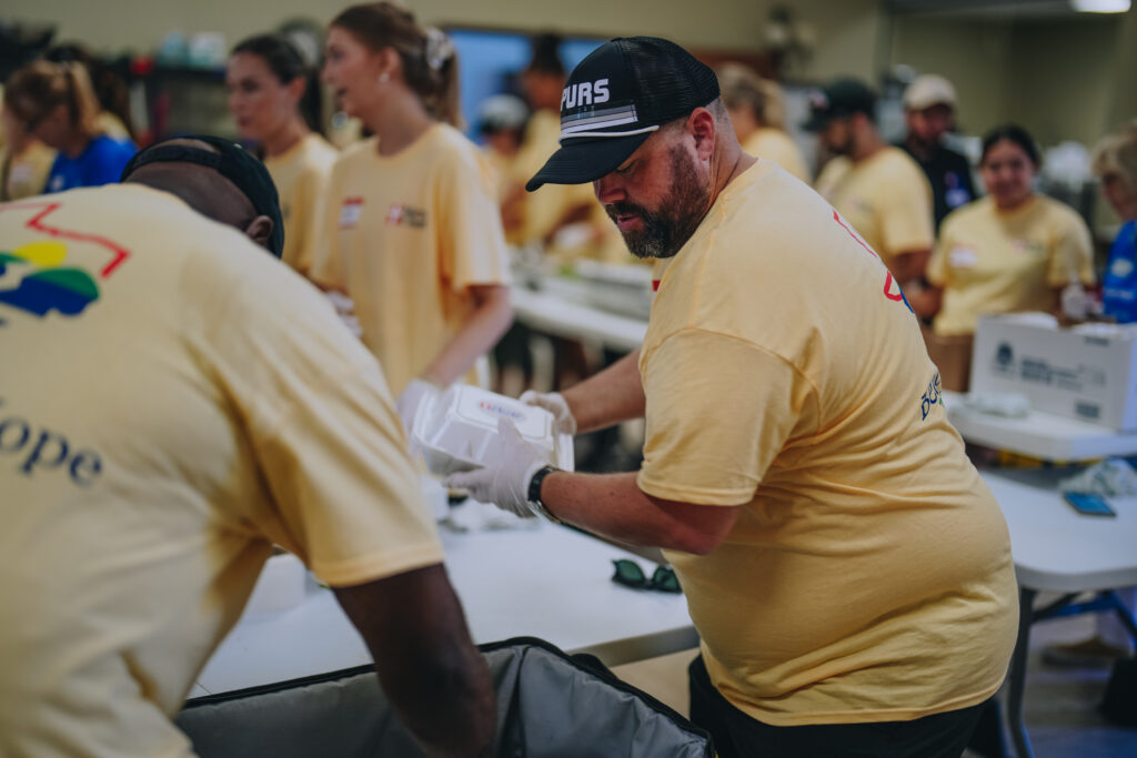 Mercy Chefs volunteers and Spur employees preparing meals for Texas flood victims