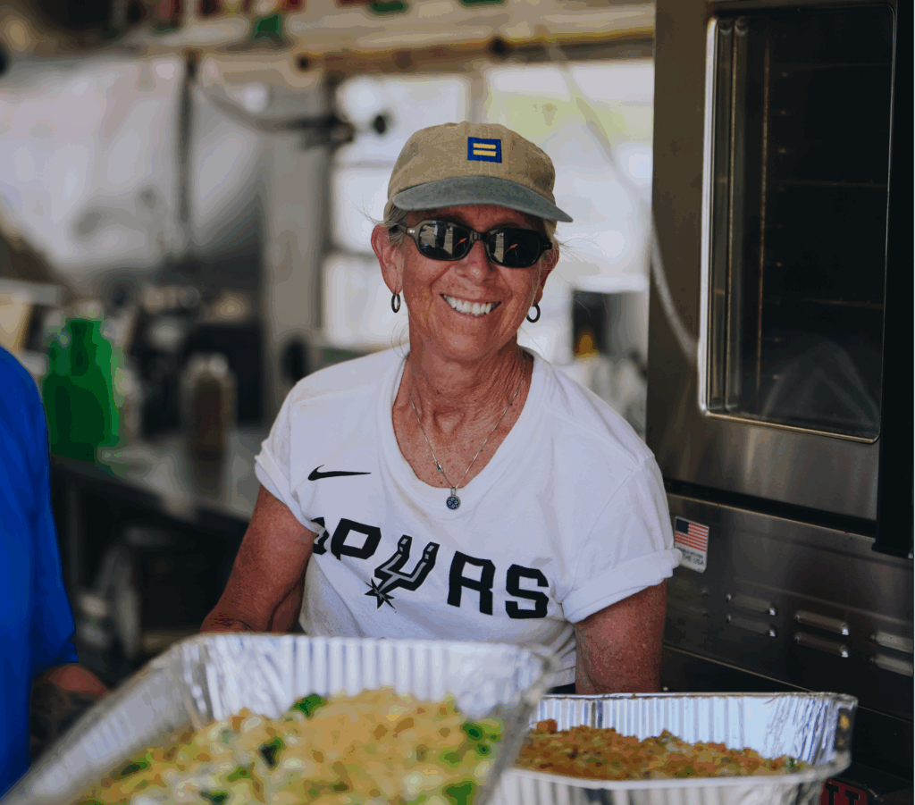 A Spur employee preparing meals for Texas flood victims