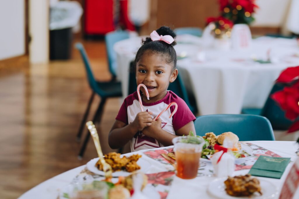 A child enjoys a Mercy Chefs meal and festive treat in Texas