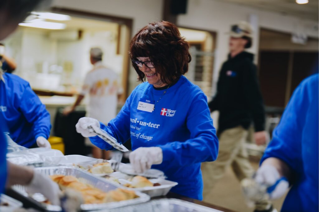 A Mercy Chefs volunteer plates meals in Michigan
